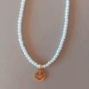 Capa 24 Collar de perlas