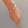 Capa 34 Pulsera de triple hilo con ojo turco